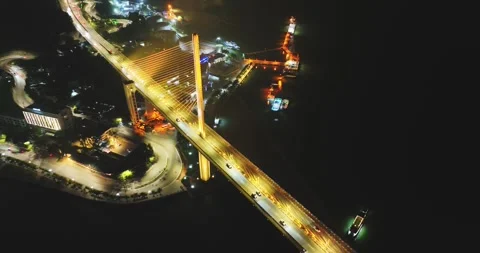 Drone view, Aerial view of Bai Chay bridge at night in Ha Long City, Vietnam Stock Footage 296853630