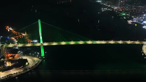 Drone view, Aerial view of Bai Chay bridge at night in Ha Long City, Vietnam Stock Footage 296854171