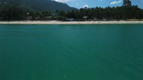Drone view. Aerial view of beautiful emerald green ocean water meeting white Stock Footage 312744166