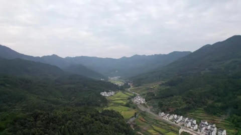 Drone view of agriculture rice fields and local Hui style buildings Stock Footage 285699515