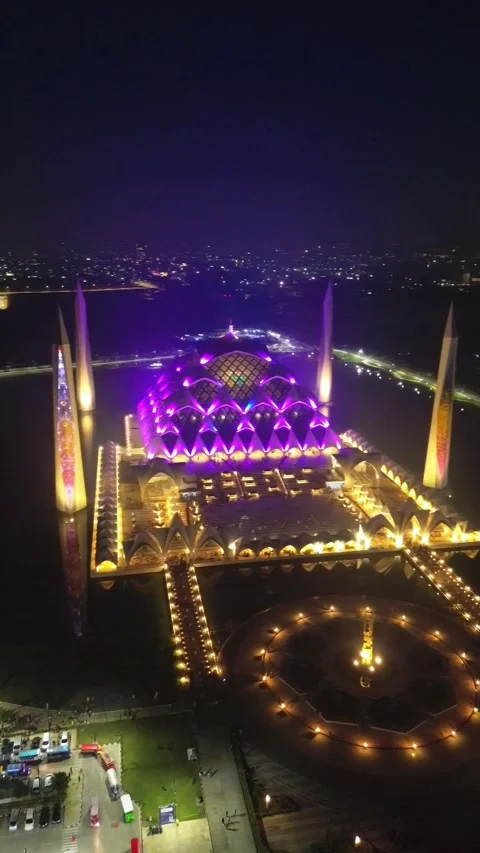 Drone view of Al-Jabbar mosque in the night with city lights. Stock Footage 277517065