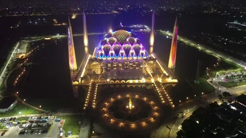 Drone view of Al-Jabbar mosque in the night with city lights. Stock Footage 277517070