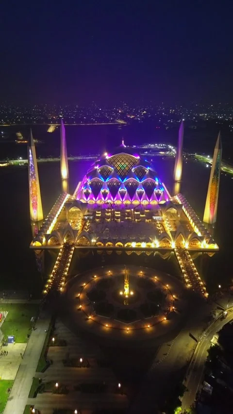 Drone view of Al-Jabbar mosque in the night with city lights. Stock Footage 277518968