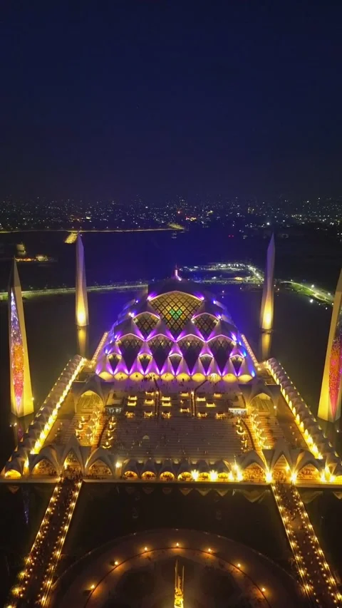 Drone view of Al-Jabbar mosque in the night with city lights. Stock Footage 277520498