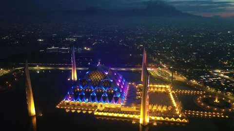 Drone view of Al-Jabbar mosque in the night with city lights. Stock Footage 277520599