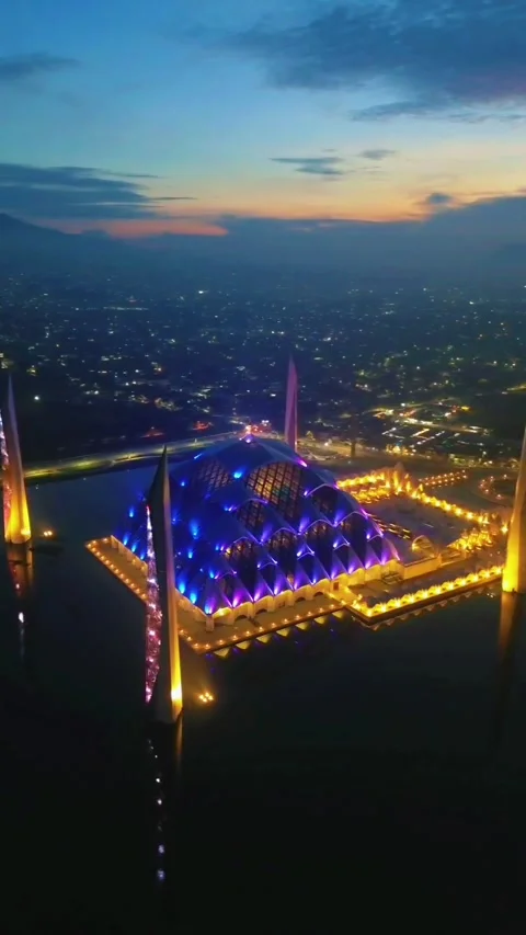 Drone view of Al-Jabbar mosque in the night with city lights. Stock Footage 277520630