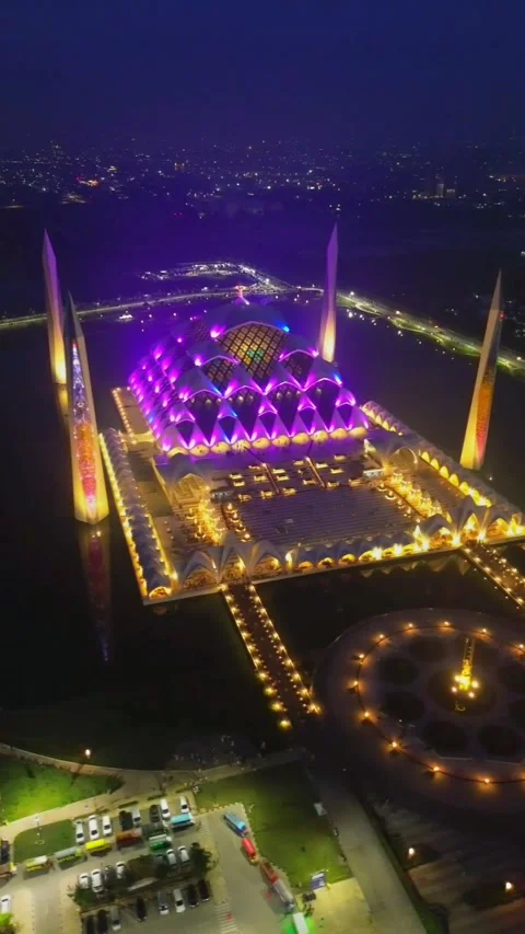 Drone view of Al-Jabbar mosque in the night with city lights. Stock Footage 277520676