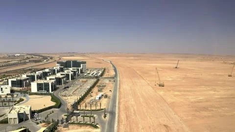Drone view along an office complex and open construction land 库存影片 346425399