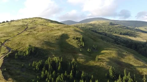 Drone View of Alpine Mountain Landscape with Green Slopes and Ridge Stock Footage 338104093