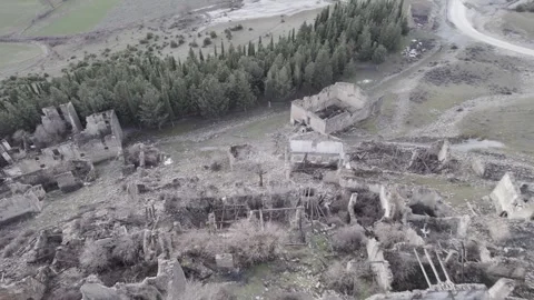 Drone view of ancient fort ruins with agriculture fields in daylight Stock Footage 264180553