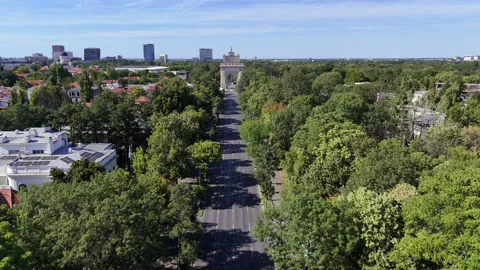 Drone view of Arch of Triumph in sunny Bucharest Stock Footage 320940248
