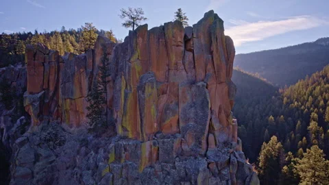 Drone view of arid rocky cliffs with clusters of trees in New Mexico desert Stock Footage 332620416