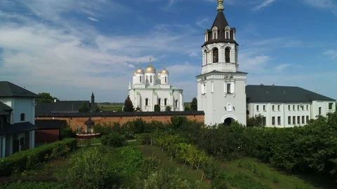 Drone view around the gilded domes of the church. Aerial view Village Zymne. Stock Footage 202255636