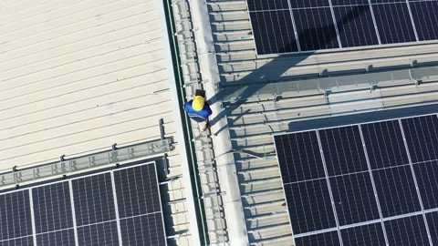 Drone view asian engineer service and checking solar cell on toproof Stockbeeldmateriaal 207919942