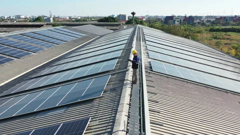 Drone view asian engineer service and checking solar cell on toproof 動画素材 207920413