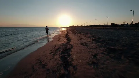 Drone view of athlete running on the summer sunset. Stock Footage 161084815