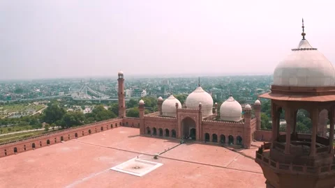 Drone view of Badshahi Mosque with minaret chhatri in foreground Stock Footage 346322196