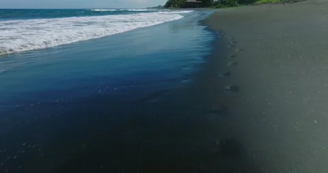 Drone view of Bali. Top view of wave on Keramas beach with black sand Stock Footage 241666774