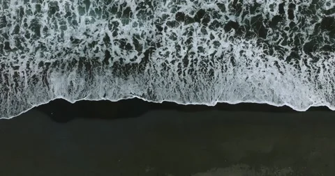 Drone view of Bali. Top view of wave on Keramas beach with black sand Stock Footage 241666891