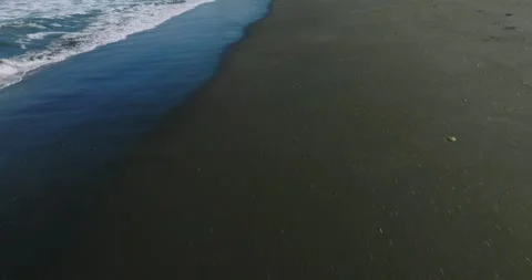 Drone view of Bali. Top view of wave on Keramas beach with black sand Stock Footage 242831082