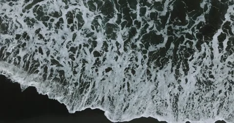 Drone view of Bali. Top view of wave on Keramas beach with black sand Stock Footage 242831163