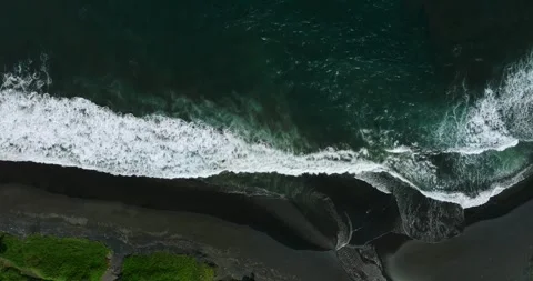Drone view of Bali. Top view of wave on Keramas beach with black sand Stock Footage 243877964