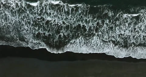 Drone view of Bali. Top view of wave on Keramas beach with black sand Stock Footage 243878006