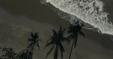 Drone view of Bali. Top view of wave on Keramas beach with black sand Stockbeeldmateriaal 244655904