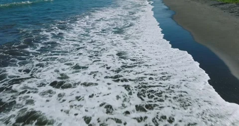 Drone view of Bali. Top view of wave on Keramas beach with black sand Stock Footage 245405086