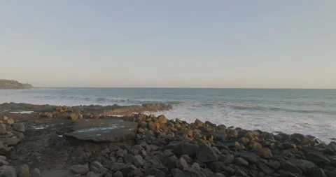 Drone view of Bali. Top view of wave on beach with rocks Stock Footage 248072229