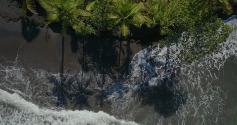 Drone view of Bali. Top view of wave on Keramas beach with black sand 스톡 동영상 249640763