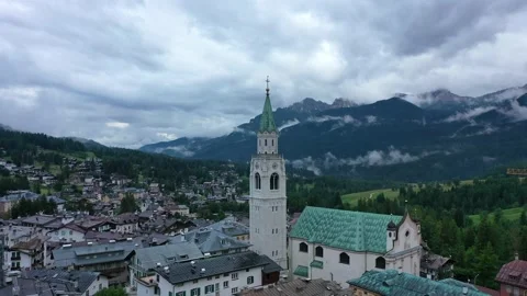 Drone view of Basilica Minore dei Santi Filippo Giacomo of Cortina d'Ampezzo Stock Footage 194435973