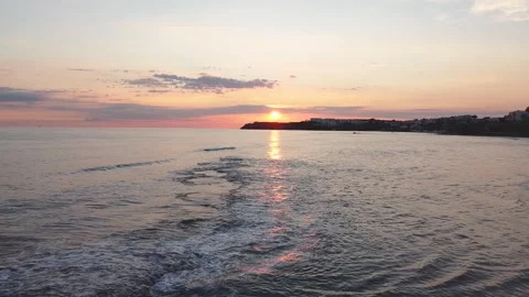 Drone view of the beach from above as the sun goes down Stock-Footage 227443048
