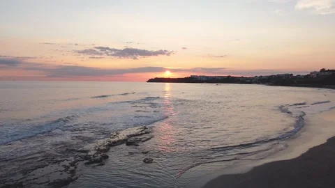 Drone view of the beach from above as the sun goes down Stock-Footage 227443672