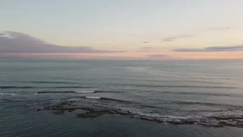 Drone view of the beach from above as the sun goes down Stock-Footage 227445308