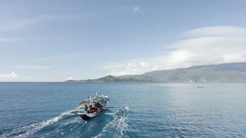 Drone View of Beach Hopping Boat Traveling Between Coastal Spots Stock Footage 237973548