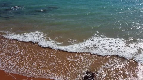 Drone view, beach, red sand, blue water, ocean Stock Footage 172529980