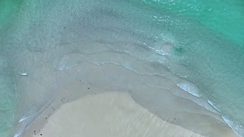 Drone view of beach in wave of turquoise sea water shot Stock Footage 236908436