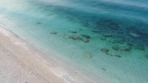 Drone view of beautiful footage while turquoise sea waves breaking on the Stock Footage 210175991