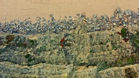Drone view - Beautiful sandy beach during rolling waves to the shore. Stock Footage 208914687