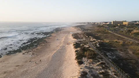 Drone view of a beautiful sandy beach large stones, wooden bridges and paths Stock Footage 254038275