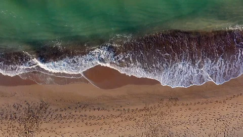 Drone view of beautiful seamless never ending footage while turquiose sea waves Video stock 127104445