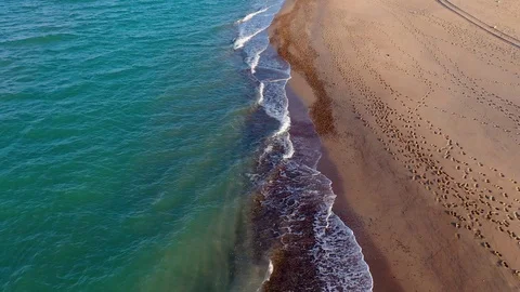 Drone view of beautiful seamless never ending footage while turquiose sea waves Stock Footage 127110957