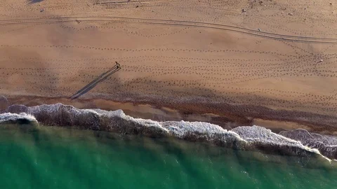 Drone view of beautiful seamless never ending footage while turquiose sea waves Stock Footage 127154723