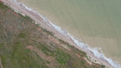 Drone view of beautiful seamless never ending footage while turquoise sea wav Video stock 130403525