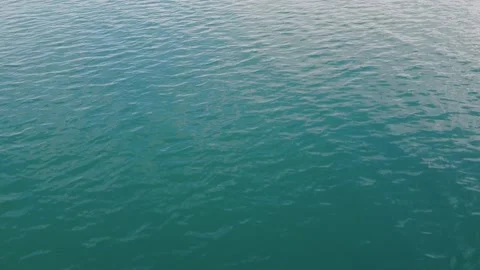 Drone view of beautiful seamless never ending footage while turquiose sea waves Stock Footage 204872925