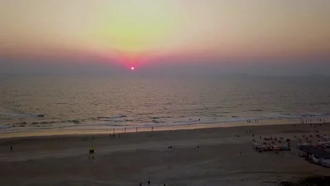 A drone view of a beautiful sunset at Utorda beach in South Goa, India. Stock Footage 180584822