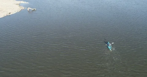 Drone view from behind of canoe in a lake Stock Footage 100615097