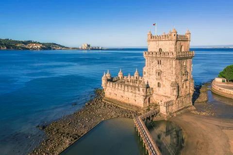Drone view of Belem tower on Tagus riverbank, Lisbon, Portugal at blue summer Stock Photos