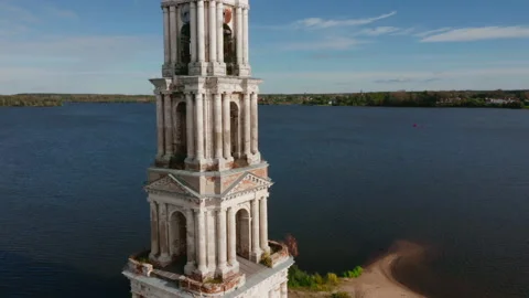 Drone view of the bell tower of a flooded church in Kalyazin city Stock Footage 145353958